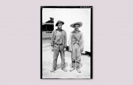 Two unnamed workers on the Madeira-Mamoré railway in Brazil, standing outside Elizabeth Kutesko