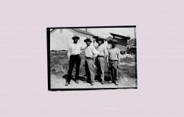 Four unnamed workers on the Madeira-Mamoré railway in Brazil, standing outside, image from Fashion and the Devil's Railroad by fashion historian Elizabeth Kutesko Elizabeth Kutesko