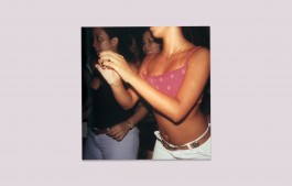 Woman dancing in white jeans and pink top with other women at night Elizabeth Kutesko